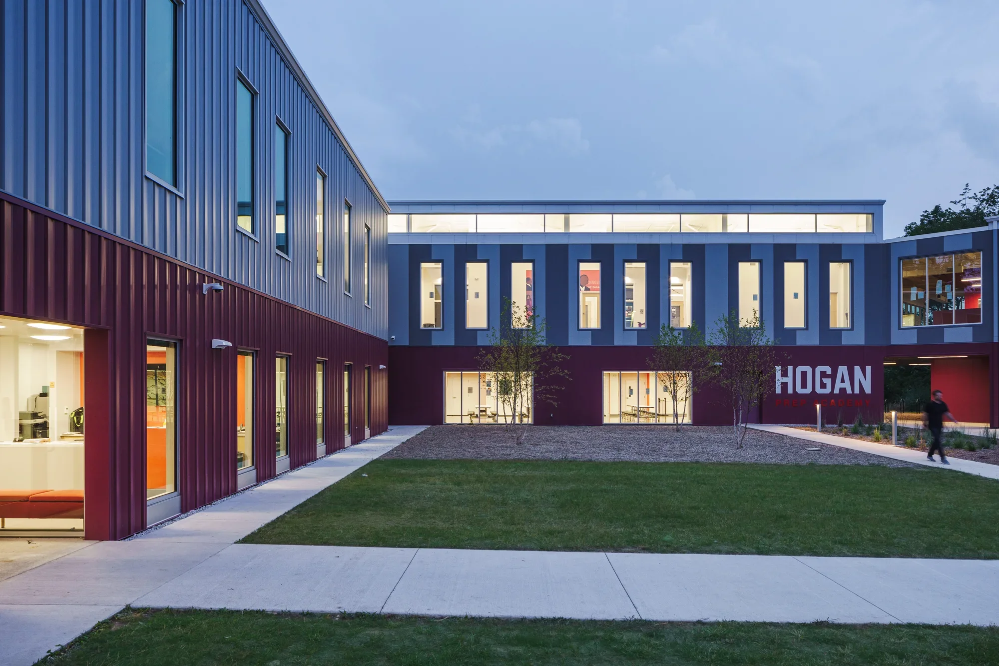 Focal Hogan Preparatory Academy grey and red corrugated metal siding modern windows exterior courtyard